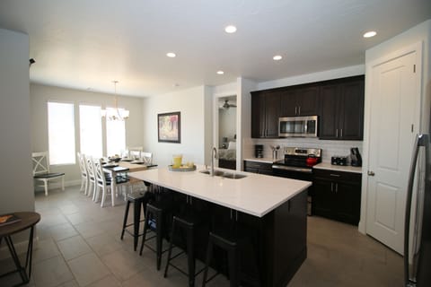 Quartz countertops, stainless steel appliances, seating for 12