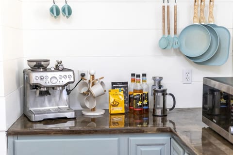 - Fully stocked coffee and tea bar featuring premium brews, syrups, and tools - Enjoy barista style mornings with a top tier espresso machine and French press - Thoughtfully arranged setup adds charm and convenience to your stay