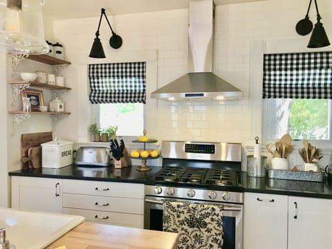 Kitchen with granite and butcher block counter tops.