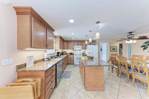 Your spacious kitchen features granite countertops, modern appliances, and an island perfect for preparing memorable meals together.