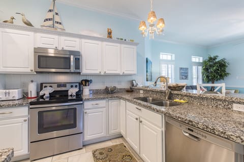Kitchen is fully stocked with pots, pans, and cooking utensils!