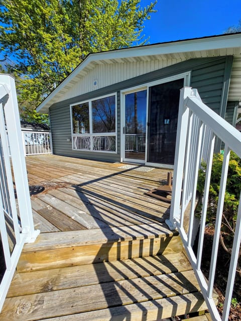 The deck leads to the sliding door off of the porch.