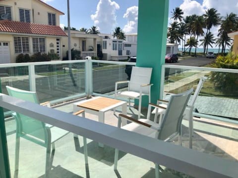 Steps from the ocean.  The perfect breezy spot to welcome the day or the night.