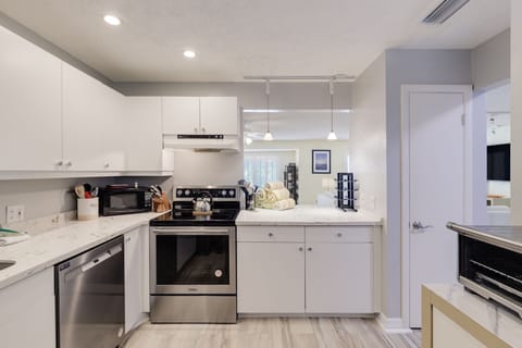 renovated kitchen with stainless appliances and quartz countertops (with glow in the dark sea animals built in)