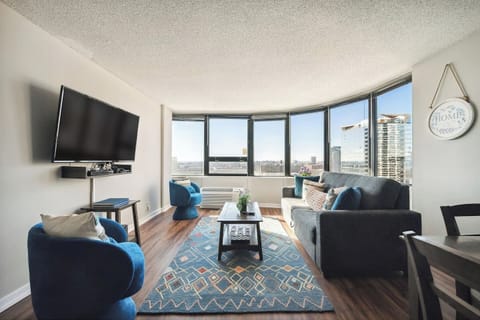 Modern living room with plenty of natural light and a City View!