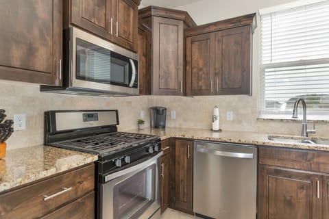 Fully stocked gourmet kitchen featuring top of the line appliances