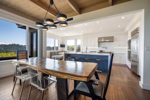 Easy flow dining room into kitchen with seating for 12