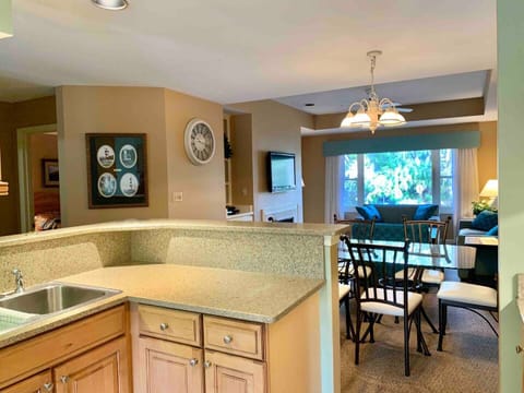View of kitchen, dining area, den