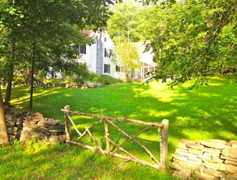 House from the road w/beautiful lawn to picnic, play, or even ski in the winter