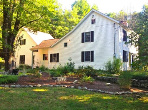 House has mature landscaping.