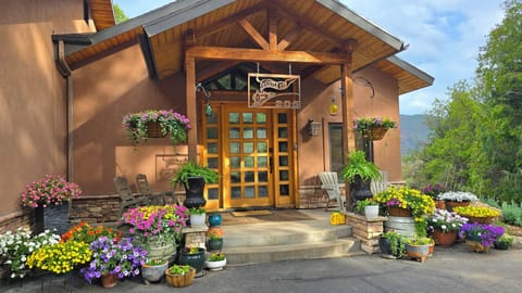Front Porch Entry. 2 rocking chairs and 2 Adirondack style chairs. 