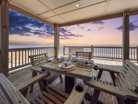 Enjoy unforgettable meals on the covered deck, surrounded by ocean breezes and breathtaking beachfront scenery.