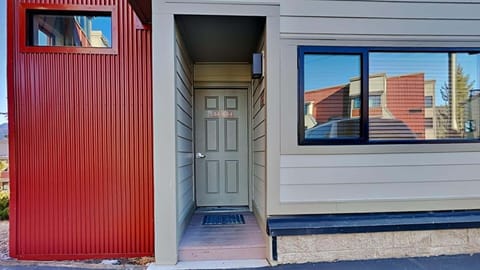 Exterior entry to condo with a view of Mammoth Mountain.