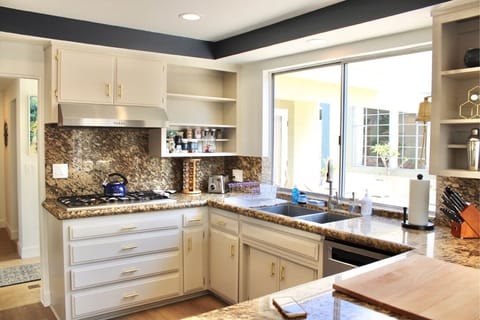 Sink, Spice Rack and Cabinet for Pots and Pans Tea kettle. 