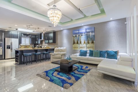 Spacious open concept living room with large flat screen tv!