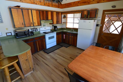 Kitchen and dining w/ door to garage walkway