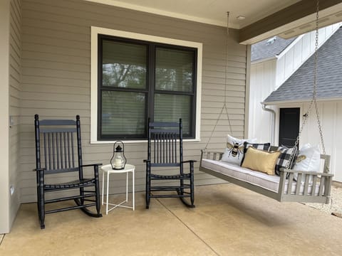 Peaceful front porch to enjoy a cup of coffee or tea on in the morning! 