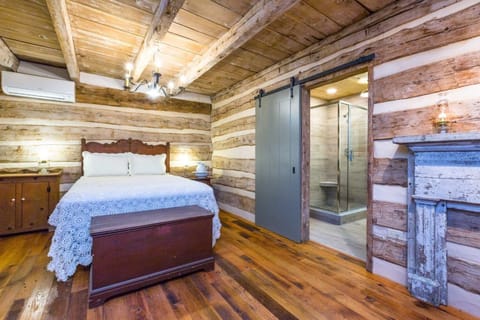 Bed and Barn door to bathroom