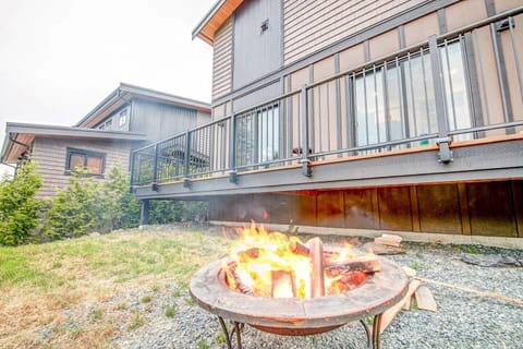 keep warm by the fire pit located in the back yard