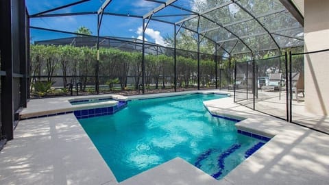 Relax by the screened-in private pool, perfect for sunny days and peaceful evenings.