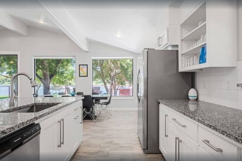 Full kitchen with full size oven, kitchen, sink, dishwasher.