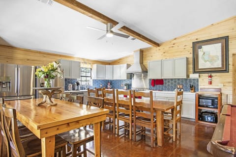 Spacious kitchen with modern appliances, plenty of seating, and rustic charm-perfect for group meals and gatherings.