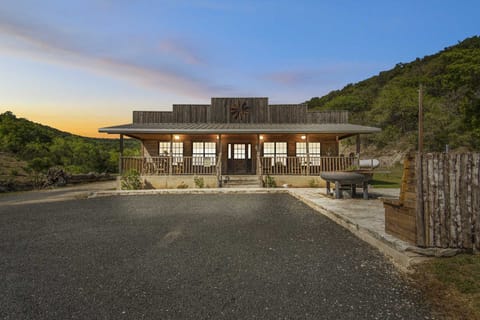 Charming rustic cabin with a western flair, nestled in the hills and perfect for a peaceful evening retreat.