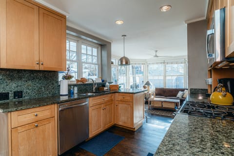 New chefs kitchen with stainless steel appliances and granite countertops