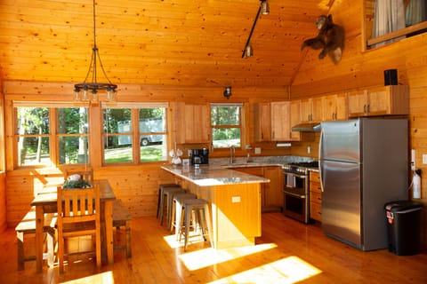 Kitchen includes brand new granite countertops and large farmhouse style table.