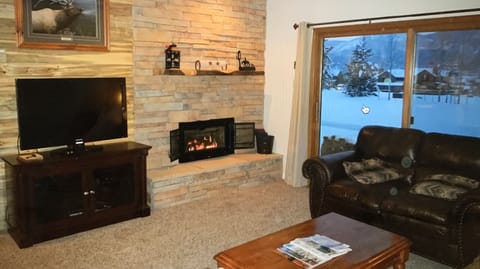 Curl up by the fireplace with a good book and a cozy blanket. 