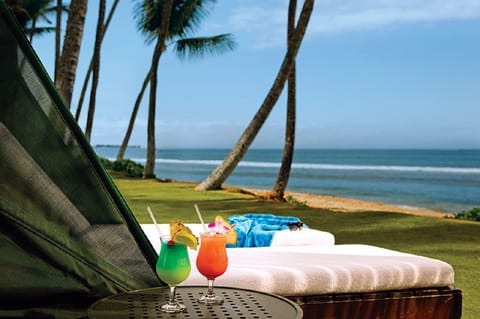 Sip a tropical drink by the beach.
