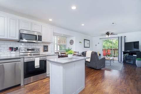 With our spacious kitchen island! The perfect spot to prep meals, enjoy a casual bite, or sip a glass of wine while chatting with friends.
