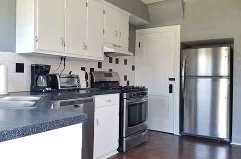 Essential kitchen utensils and cookware are available.
