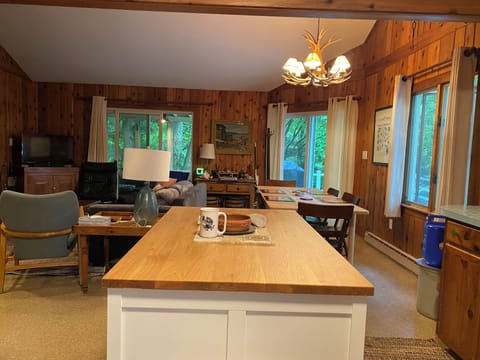 Kitchen island with stools, opens to dining and living area