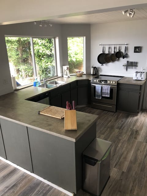 A kitchen with modern appliances and a waterfront view that just cannot be beat.