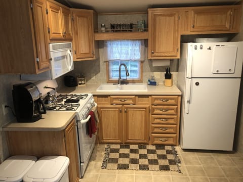 Coffee Pot, Keurig Maker, Toaster Oven, Microwave, Full Fridge with Ice Maker.