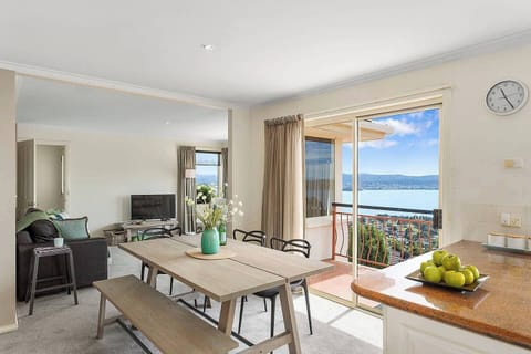 With a table that invites shared dining experiences, you can enjoy your meals while soaking up the breathtaking views of the Derwent River.