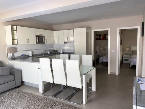 Downstairs living area with view to bedrooms 2 and 3