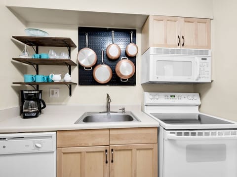 Fully-stocked kitchen with electric stove