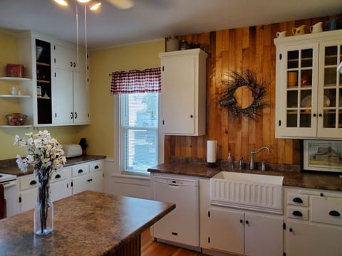 Farmhouse sink and dishwasher help make cleanup a breeze.