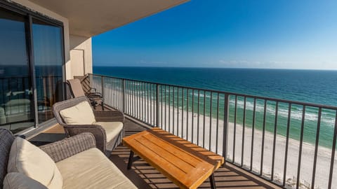 Enjoy the comfortable seating of the balcony while relaxing with expansive views of the tranquil waters and shoreline