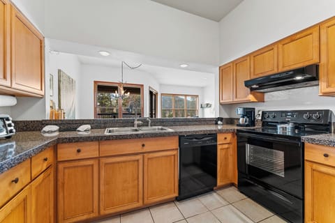Full size kitchen with granite countertops.