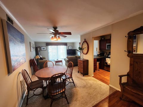 The living room comes furnished with essential pieces, including a comfortable sofa, a coffee table, and a TV stand, providing immediate comfort upon move-in.