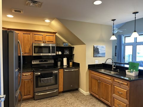 Enter into well-stocked kitchen