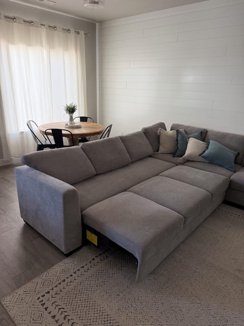 Couch pulls out for a bed or foot rest