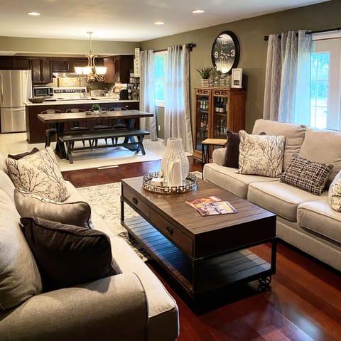 Family room.  One of many gathering rooms.  Natural fireplace & 58” smart TV