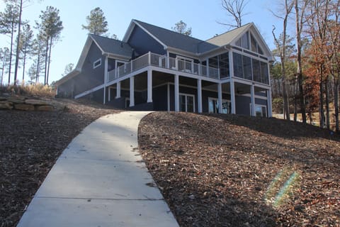 Back of house, lots of windows with view of the lake