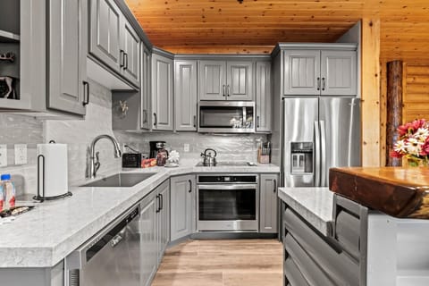  2 kitchens - Rustic kitchen blends modern appliances with cozy cabin charm and warmth.
(Photo of Side A)