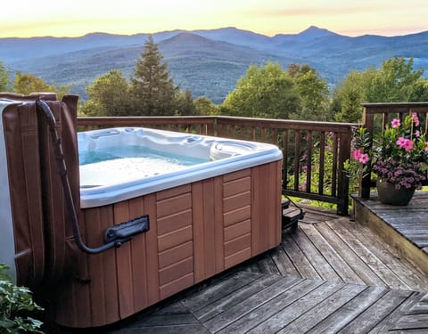 Watch the sunset over Camels Hump mountain from the hot tub