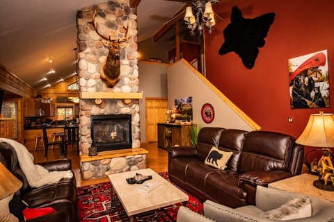 Upon entry is the cozy living room w/ a stunning River Rock gas fireplace and staircase. Ahead is the dining room and fully equipped kitchen & laundry